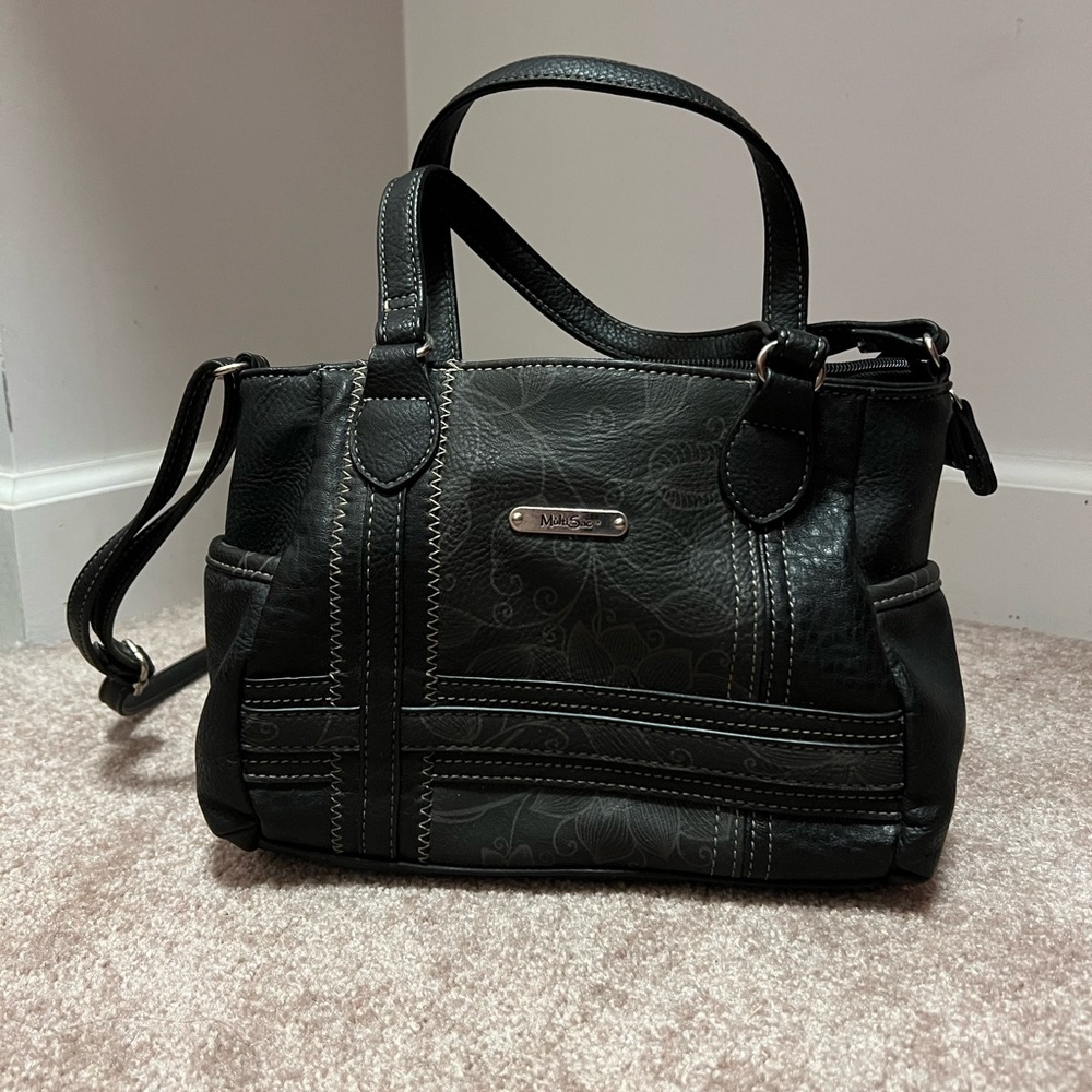 Black small purse with gray pattern.